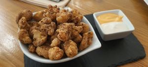Popcorn cauliflower. Yummy and well seasoned. The vegan spicy mayo is the best!!! Ask for it with your sushi. at Roots & Rolls in Barcelona