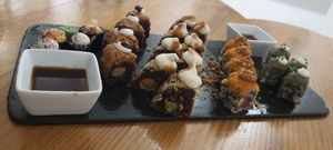 Taste plate. The maki and the hip carott were the best. Didn't like the one in the middle with the coconut cream. at Roots & Rolls in Barcelona