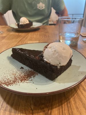 Chocolate cake/brownie with coconut ice cream  at Roots & Rolls in Barcelona