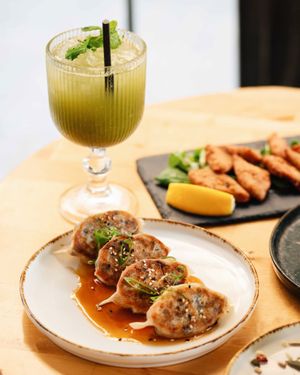 Roots & Rolls gyozas filled with shiitake mushrooms & Roots & Rolls sweet dashi sauce at Roots & Rolls in Barcelona