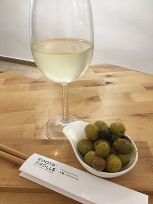 Original, tasty White wine and olives  at Roots & Rolls in Barcelona