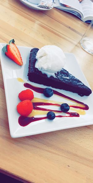 avocado brownie with coconut icecream  at Roots & Rolls in Barcelona