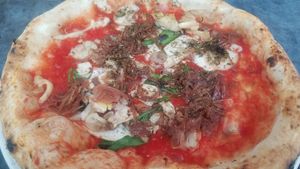 Sauce, basil, oregano, caramelized onions and wild mushrooms at Franco Manca in Bath