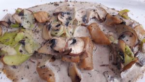 mushrooms with garlic shoots and heura (vegan protein) at Restaurante Vegano Tierra Madre in Valencia