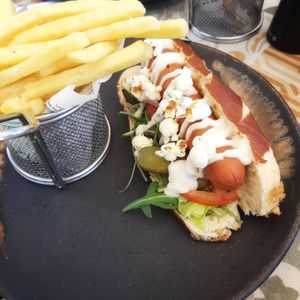 Moving Mountains Hot Dog in a pretzel bun with popcorn at Seashells Healthy Living in Limassol