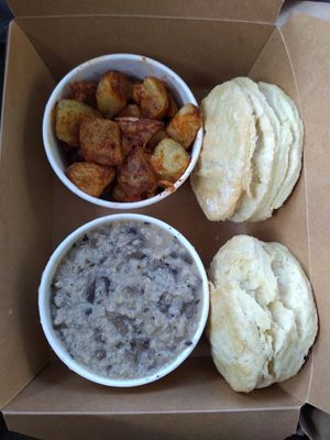Biscuits and gravy with a side of roasted potatoes at Essen Kitchen in Cincinnati