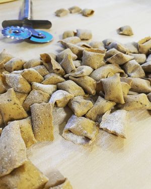 Raviolini del plin con impasto all’aglio nero di Voghiera at Antica Casa Rava in Alessandria