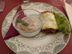 Flan di formaggio con crema ai funghi e involtino con cipolla e formaggio at Antica Casa Rava in Alessandria