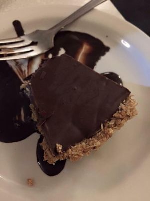 Choco-Banane Tart: Delicious smooth and creamy chocolate filling with a fresh banana flavour inside a flaky, tender pastry crust. at Aux Vivres - St Laurent in Montreal