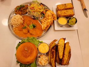 Malai Kofta Thali, Cornbread, Spicy Buffalo Burger at Aux Vivres - St Laurent in Montreal