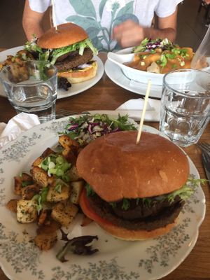 Poutine and burgers with potatoes and salad  at Aux Vivres - St Laurent in Montreal