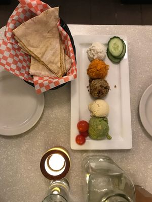 Starter of mixed spreads with “cheese” bread at Aux Vivres - St Laurent in Montreal