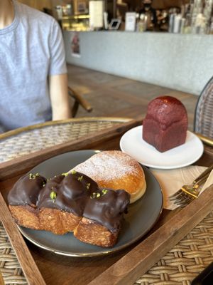 Chocolate covered cinnamon bun, soy cream pastry, and red rice flour bread  at Doco - City Farm House Cafe in Busan