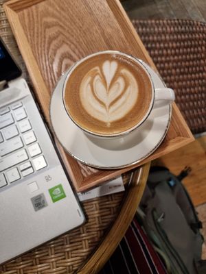 Latte with oatmilk at Doco - City Farm House Cafe in Busan