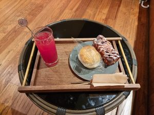 Watermelon juice with cinnamon bread and a coconut cream bun at Doco - City Farm House Cafe in Busan