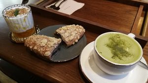 Orange lime yoghurt, a black sesame pastry and green tea latte. at Doco - City Farm House Cafe in Busan