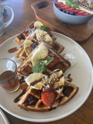 Waffles with fruit and a smoothie bowl   at I Am Vegan Babe in Canggu