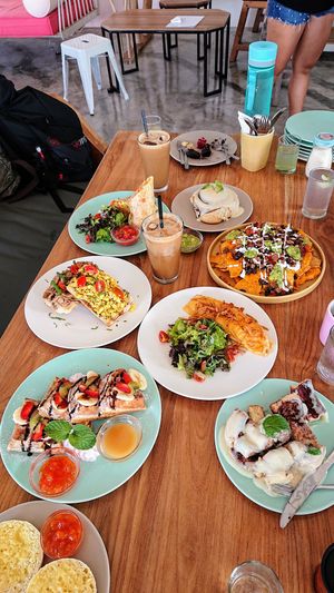 English muffin, Hello Waffles, tofu scramble on toast, mushroom on toast, Uncle Rudy iced Bali coffee, burrito, lime juice, assorted cakes, cinnamon roll, nachos, Power Omelette at I Am Vegan Babe in Canggu