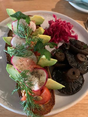 Avocado sourdough with tomato, relish, radish, dill, seeds, kraut and I added mushrooms. Delicious, healthy and fresh food.  at Felix For Goodness in Brisbane