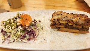 Vegan Moussaka with a side salad at Vegan Food Tour Athens in Athens