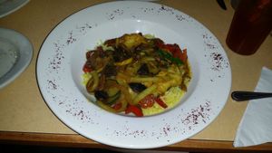 Vegetarian Delight - Fresh mushrooms, green & red peppers, yellow squash & zucchini sautéed in olive oil & our special blend of seasonings topped with feta cheese, served on top of rice (remove feta to make vegan) at Petra Cafe in Hattiesburg