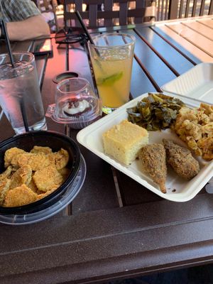 Soul food plate with 2 drumsticks, collard greens, Mac n cheese, and cornbread. Fried pickles for appetizer and red velvet cupcake for dessert. Trust me. It’s all gone now 😋 at VelTree in Charlotte