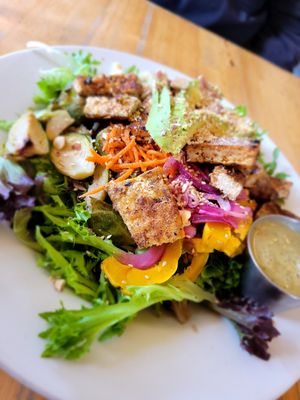 Salad veganized with added avo and grilled tofu. Was delicious. Dislike extra charges when removing dairy n not a substitute. at Cafe Phoenix in Arcata