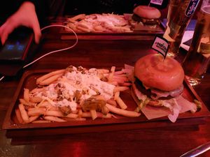 Garlic cheese fries and a darko burger and jalapeño cheese fries with a sriracha burger. Was decent at the moment but we got sick after at Thunder Road Cafe in Dublin