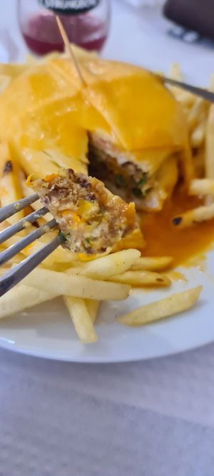 Super tasty and original vegan option. The vegab francesinha is made with a homemade quinoa burger, the bread is a 'bolo do caco' (without any animal ingredients) and vegan cheese. at Pimenta Doce in Viana Do Castelo