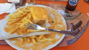 Half-eaten Francesinha at Pimenta Doce in Viana Do Castelo