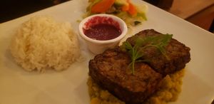 Mushroom steak with blackberry sauce (and pois cassés on each plate) at Veget'Halles in Paris