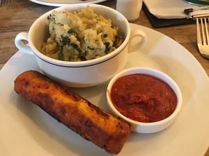 mash and sausage in a roll at Dash Garden Cafe in Nottingham