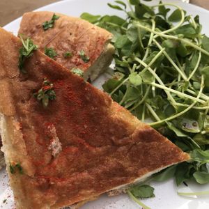 Smoked cashew and caramelised onion toastie with greens  at Dash Garden Cafe in Nottingham