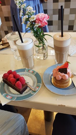 Vegan & sugarfree chocolate truffle w/ raspberries & vegan strawberry rhubarb cake, vegan chocolate latte macchiato on right at Isabella Glutenfree Pâtisserie - Calwerstr in Stuttgart