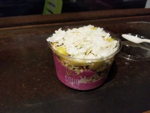Smoothie bowl with pitaya, pineapple, coconut, etc.  Delicious! at SoHo Juice Co in Winter Park