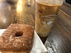 Glazed donut and iced coffee at Leguminati Vegan Eatery in Orlando