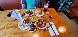 Original chick'n sandwich, okra, potato wedges, mashed potatoes and gravy, macaroni and cheese, lemonade, and sweet tea at Binge Kitchen in San Antonio
