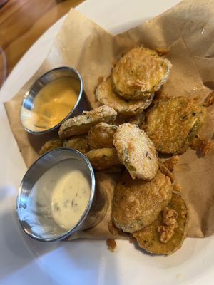What is left of the fried pickles. Sooo good!  at Binge Kitchen in San Antonio