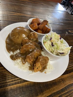 Smothered chick’n and gravy with 3 sides—mashed potatoes, coleslaw, and yams  at Binge Kitchen in San Antonio