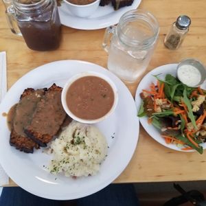 Meatloaf plate with 3 sides,  mashed potatoes, baked beans, side salad at Binge Kitchen in San Antonio