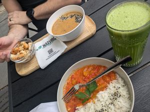 A curry, mushroom soup and a fresh juice. at Naturo Healthy Food in Sibiu