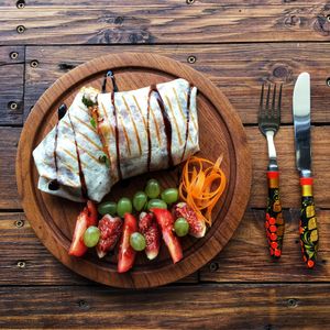 Tortilla with tofu, vegetables and dressing with blueberrys! at Faine in Brno