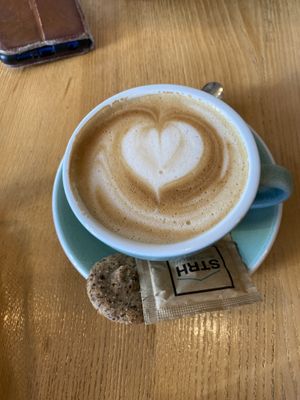 flat white with oat milk (cookie isn’t vegan)  at Strh Cafe & Gallery in Zakopane