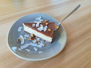 coconut-based vegan "cheesecake" with chocolate on top at Strh Cafe & Gallery in Zakopane