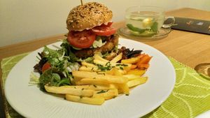 Vegan Burger. Very food and juicy patty, delicious sides at Prasad in Prague
