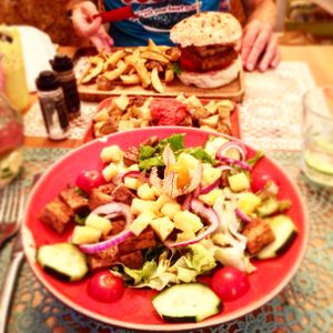 Tofu salad, batatas fritas and vegan burger  at Saibos in Lagos