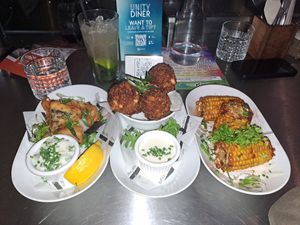 Tofish bites, tuna mac and cheese balls, corn. at Unity Diner in East London