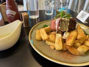 Redefined Meat steak wrapped in bacon with mashroom sauce   at Unity Diner in East London