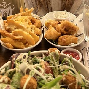 Tofish bites, cheesy fries and chicken Caesar salad   at Unity Diner in East London