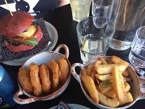 Surge burger with onion rings and chips at Unity Diner in East London